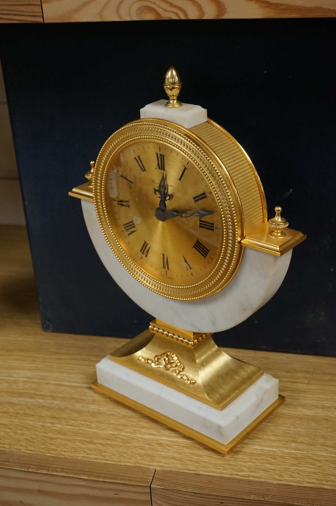 A 1970's Hour Lavigne white marble and gilt bronze mantle timepiece, boxed, 29cm high